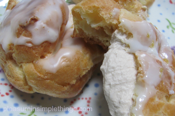 cream puffs filled with earl grey infused whipping cream and topped with lemon glaze