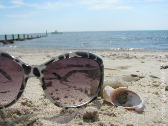 photo of sunglasses on the beach